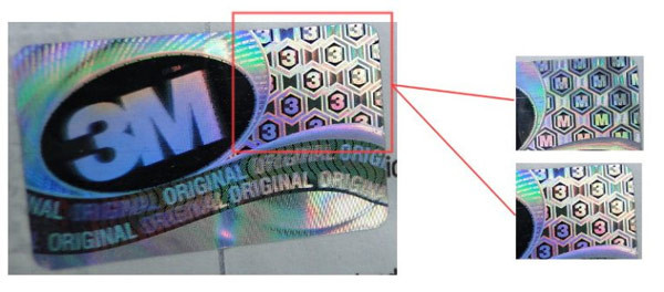 Tem trên khẩu trang 3M thật khi thay đổi góc nhìn bạn sẽ đọc được chữ “3” hoặc chữ “M”. Tuy nhiên tem chống hàng giả chỉ dán trên hộp, nên nếu mua lẻ khẩu trang 3M bạn nên chú ý tới các đặc điểm phân biệt ở trên. Ảnh: Quantrimang.