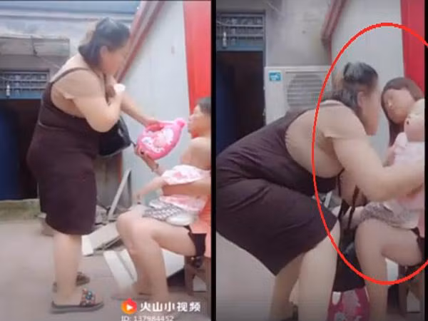 Sau đó, người này nhanh chóng bế đứa bé đi khi mẹ em bé đã ngất (Ảnh cắt từ clip).