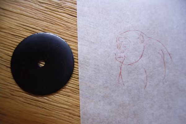 Hình ảnh phác họa mặt đồng hồ hình khỉ.