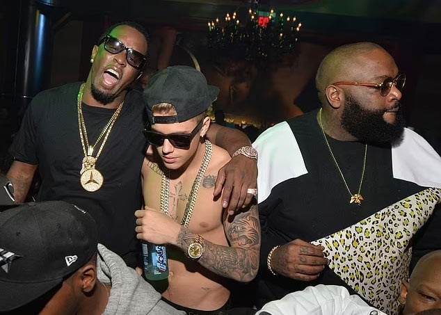 Justin tiệc tùng với Diddy và Rick Ross vào năm 2014. (Ảnh: FilmMagic)