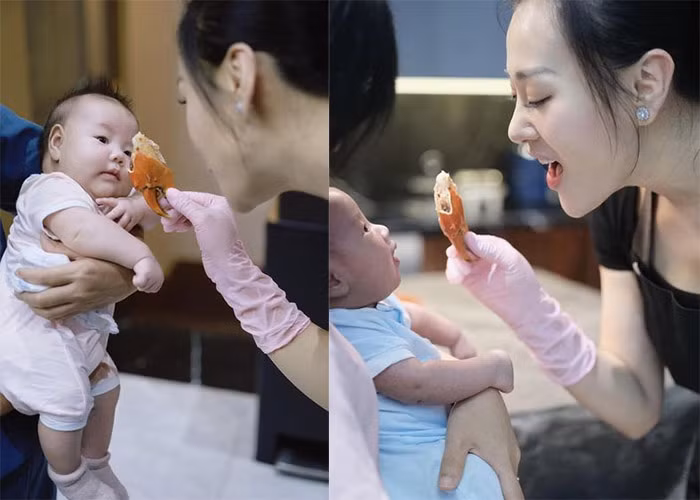 Khoảnh khắc vừa nấu ăn vừa nựng con rất đáng yêu của diễn viên Phương Oanh.