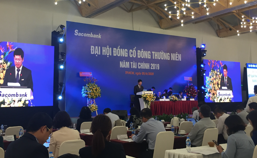 Chu tich HDQT Sacombank Duong Cong Minh: “HDQT chung toi bi tren de duoi bua”