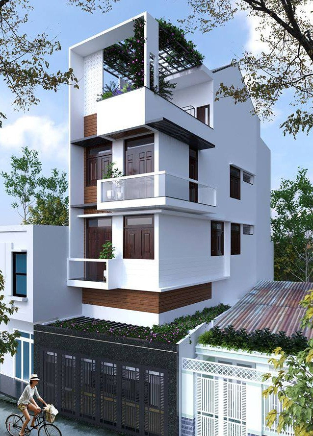 Nhà phố 4 tầng với cấu trúc hình khối đẹp mắt, tân dụng lợi thế mặt bên trống để thiết kế cửa sổ mang ánh sáng đến toàn bộ không gian bên trong nhà. Ảnh: Song phát construction