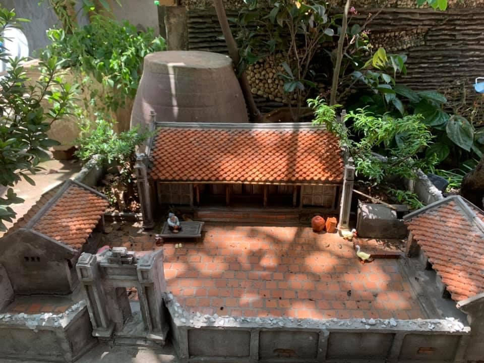 Mô hình kiến trúc khi hoàn thiện được trang trí cây cảnh bonsai, người, trâu... mini thêm sinh động. Ảnh: Vietnamnet