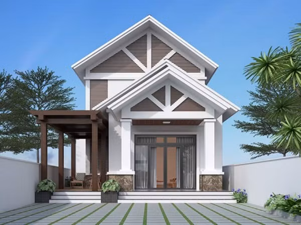 Mẫu nhà cấp 4 mái thái nổi bật với mái ngói xám đen, mặt trước được thiết kế với phong cách bất đối xứng tinh tế. Ảnh: Gachtranh3d.