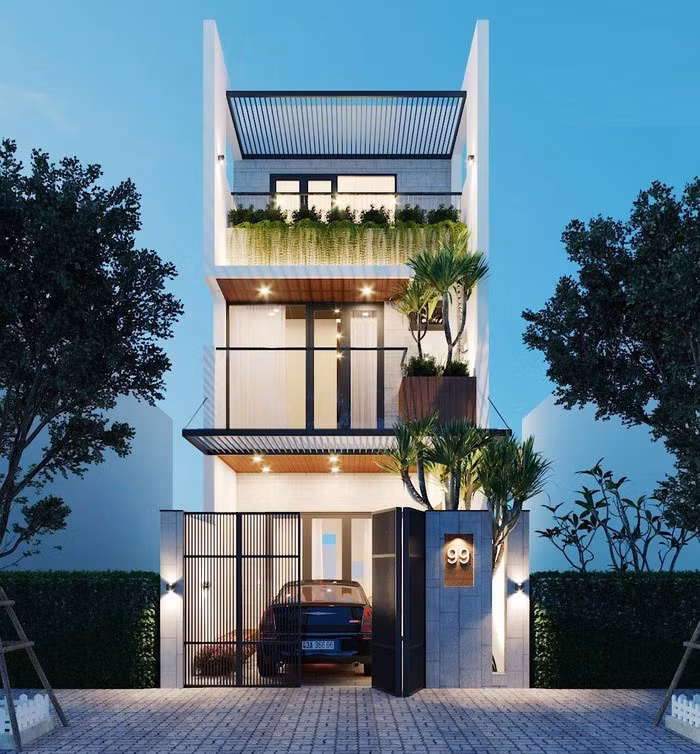 Nhà ống cao 3 tầng mang phong cách kiến trúc hiện đại. Mỗi tầng đều có cây xanh giúp điều hòa không khí. Ảnh: Xaydungphatdat