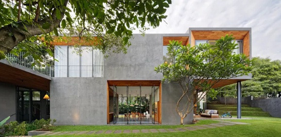 Nhà bê tông khối hộp với không gian sân vườn bao quanh. Ảnh: Homify.