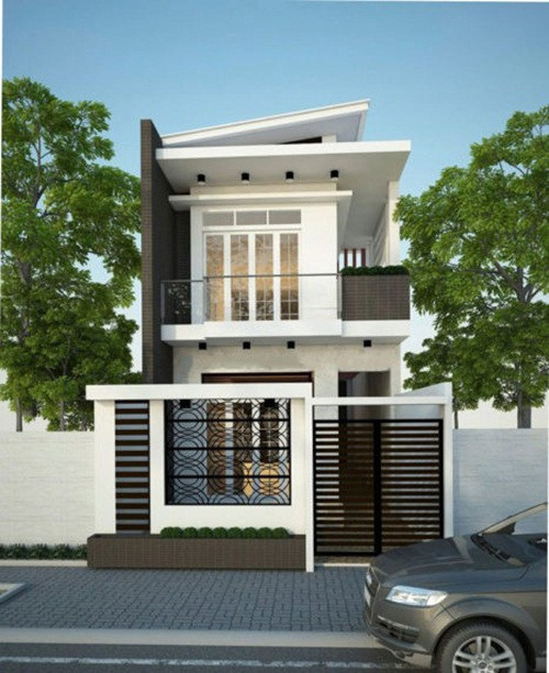 Nhà phố 2 tầng thiết kế theo kiểu mái lệch tránh tạo sự đơn điệu. Phía trước phần ô văng đua ra của ban công được thiết kế mi cửa đua ra để chắn nắng chiếu thẳng vào trong nhà. Ảnh: Internet.