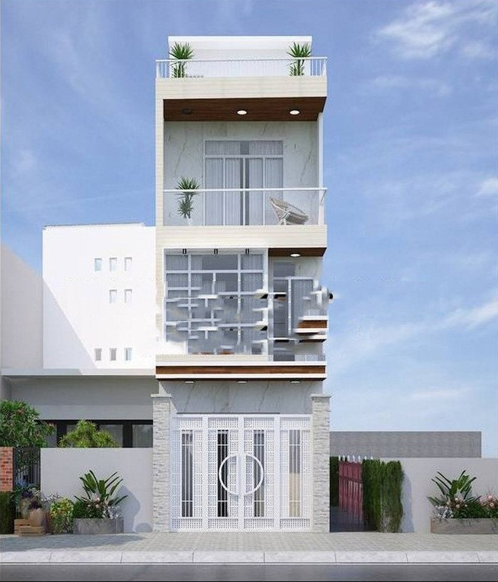 Nhà ống 3 tầng 1 tum thiết kế với gam màu màu trắng nổi bật. Cửa sổ, lan can ban công đều được làm bằng kính cường lực trong suốt tôn lên vẻ hiện đại. Ảnh: Nhadepktv.