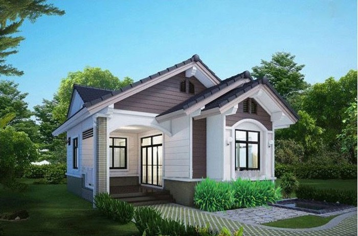 Ngôi nhà 1 tầng 3 phòng ngủ ấn tượng nhờ kiến trúc 3 gian truyền thống, có cửa gỗ sang trọng. Ao lớn trước nhà giúp không khí thoáng mát. Ảnh: Kientrucsuvietnam.