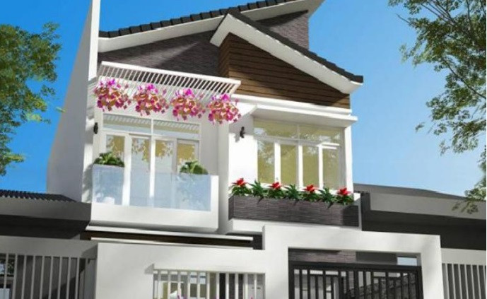 Ngôi nhà 2 tầng tinh tế với gam màu trắng sáng cùng hàng rào đẹp mắt. Ảnh: Thietkepro.