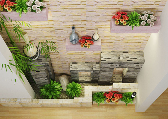 Một vườn cây nhỏ ngay chân cầu thang, cạnh giếng trời sẽ mang lại nguồn không khí trong lành cho gia đình.