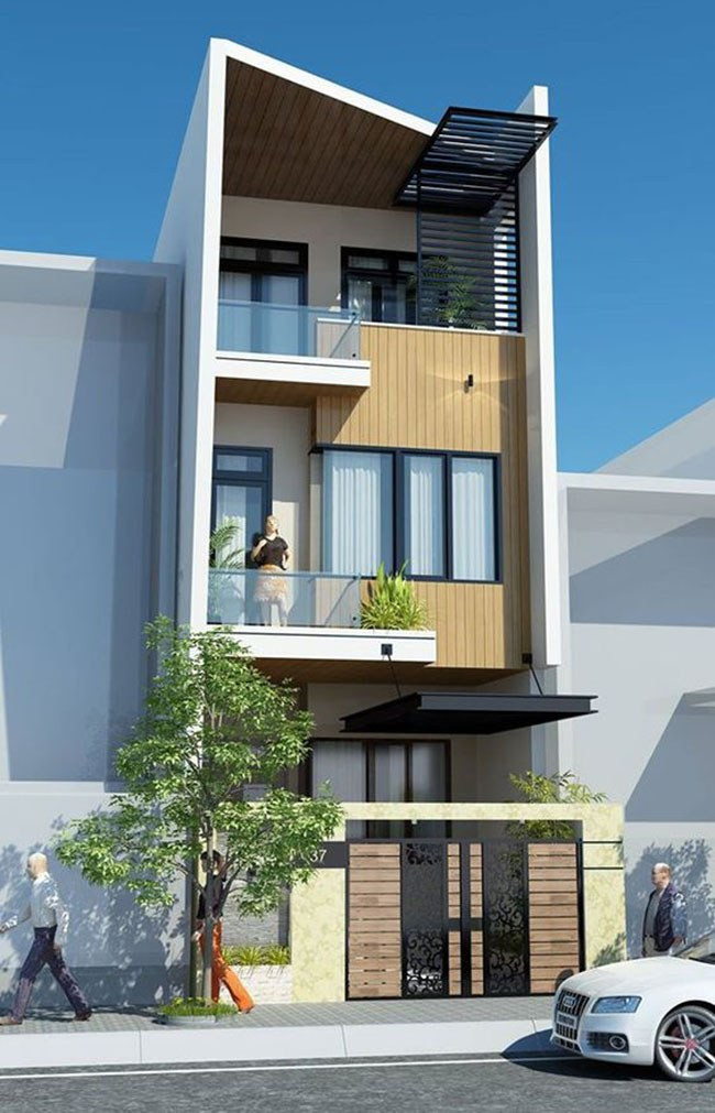  Mẫu nhà ống 2 tầng 1 tum vô cùng bắt mắt với sự kết hợp hoàn hảo của gỗ và sắt. Ảnh: Wedo.