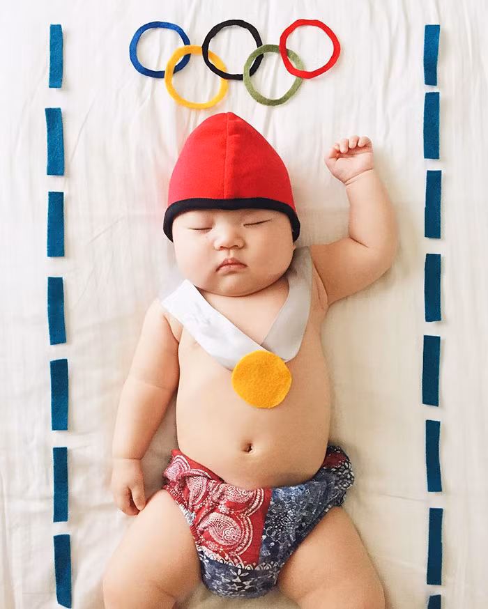 Vận động viên bơi lội bụ bẫm lấy được huy chương vàng Olympic khi đang ngủ say.