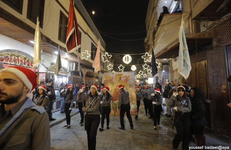 Người dân Syria diễu hành trong dịp lễ Giáng sinh 2018. Ảnh: RT.