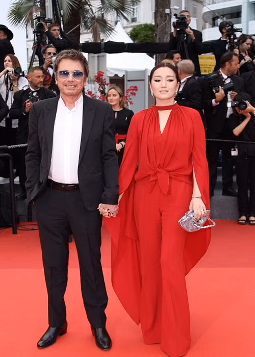 Củng Lợi cùng chồng tham dự thảm đỏ Cannes ngày thứ ba. Ảnh: Sina.