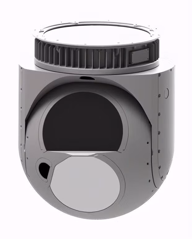 Những chiếc UAV TB-2 trên danh nghĩa được sản xuất tại Thổ Nhĩ Kỳ, nhưng công nghệ quang điện, động cơ, hệ thống vũ khí đều mua của nước ngoài; mặc dù hệ thống vũ khí gần đây đã được chuyển giao cho Thổ Nhĩ Kỳ, nhưng công nghệ quang điện tử vẫn dựa phụ thuộc vào công ty Beraketa của Canada; đầu dò hồng ngoại là của FLIR (Mỹ); động cơ là từ Rotax 912 của Áo. Ảnh: Tháp quang điện của UAV TB-2. Nguồn: Wikipedia.