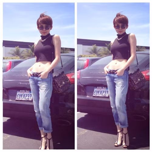 Mẫu túi xách da báo của thương hiệu Dolce &amp; Gabbana tăng thêm nét mạnh mẽ và cá tính cho nữ ca sĩ.