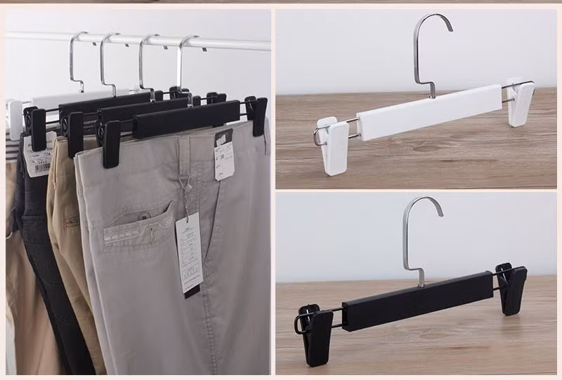 6. Treo quần sai cách: Treo gấp đôi quần trên mắc thường để lại đường hằn ngang rất mất thẩm mỹ. Cách tối ưu nhất là dùng móc cặp vào phần cạp quần hay gấu quần và treo quần thẳng đứng để giữ độ phẳng phiu. Ảnh: moctreohangtrungbay.vn.