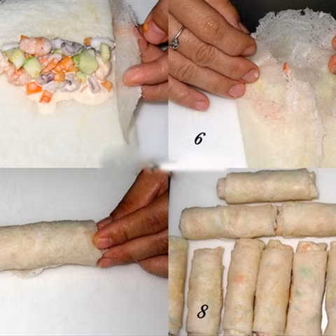 Chia hỗn hợp nhân thành 10 phần. Trải bánh tráng ra, cho 1 phần nhân vào, gấp 2 mép, cuộn chặt tay. Đun nóng dầu ăn. Đánh tan 1 quả trứng gà, nhúng cuốn chả giò qua trứng rồi lăn qua bột xù, cho vào chảo chiên ngập dầu ở lửa trung bình cho vàng giòn. Ảnh: Cooky.vn.