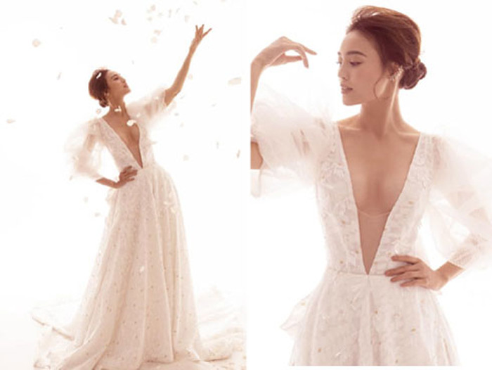 Hoặc ngay cả khi mặc đầm trắng tinh khôi, Lan Ngọc vẫn có cách khiến người nhìn “đứng hình” bởi thiết kế cổ khoét sâu tận rốn khoe nửa vòng 1 căng đầy. Ảnh: FBNV.