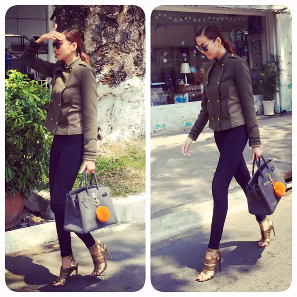 Siêu mẫu khai thác vẻ đẹp của hình thể với quần skinny phối đơn giản với áo khoác xanh rêu tiệp màu sandal chiến binh và chiếc túi xách size to "chất lừ". Ảnh: thegioituida.com. 