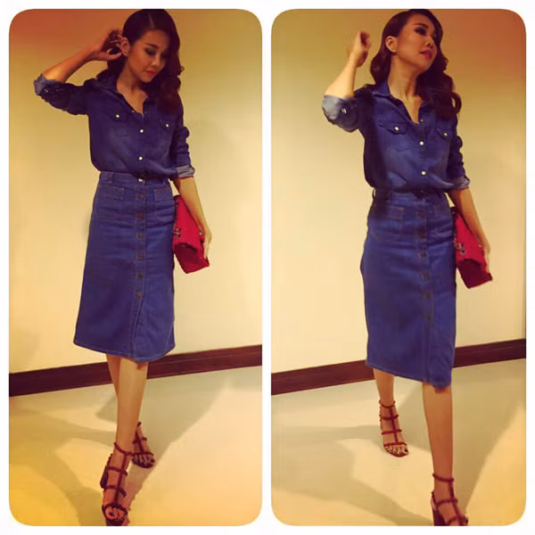 Thanh Hằng bắt kịp mốt váy cài nút trên chất liệu jean - chất liệu luôn tạo nên "cơn sốt" nhung dùng túi màu hồng để tôn vẻ nữ tính, yêu kiểu. Ảnh: thegioituida.com.