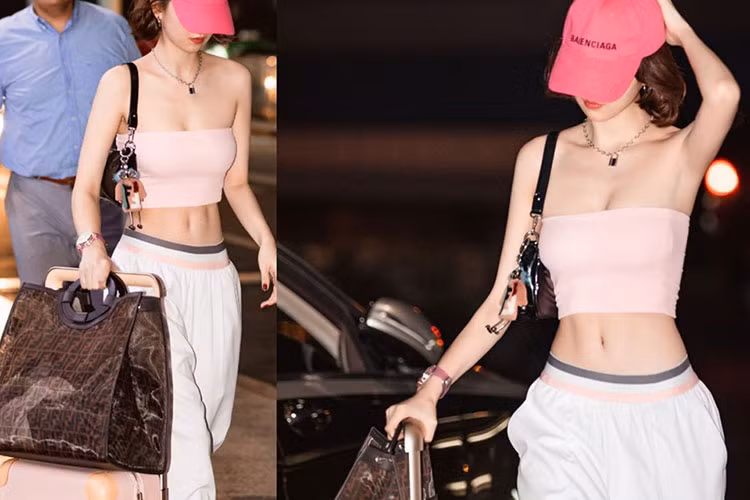 Ngọc Trinh chuộng áo crop top, khoe vòng eo con kiến trứ danh cùng khuôn ngực quyến rũ.