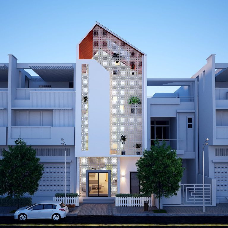 Mẫu nhà ống 3 tầng thiết kế đơn giản, tinh tế bằng cách sử dụng gạch bông thông gió màu trắng ở mặt tiền phía trước. Mái lệch hài hòa với kiến trúc hiện đại