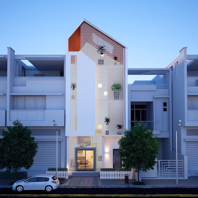 Mẫu nhà ống 3 tầng thiết kế đơn giản, tinh tế bằng cách sử dụng gạch bông thông gió màu trắng ở mặt tiền phía trước. Mái lệch hài hòa với kiến trúc hiện đại
