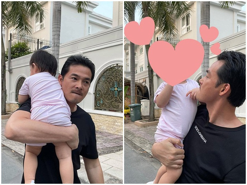 Nam diễn viên bồng bế con gái đi chơi.