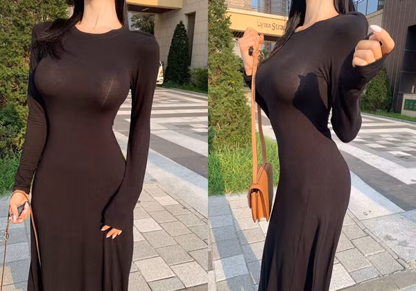 Mặc chiếc váy dáng dài không hề cắt xẻ, cô gái này còn cẩn trọng chọn thiết kế dài tay để dạo phố. Vậy nhưng, chất liệu co giãn kết hợp với vòng 1 ngoại cỡ khiến cô để lộ màu nội y nổi bật giữa nền đen.