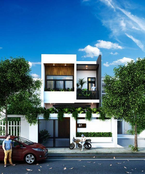 Không gian cây xanh được bố trí từ cổng tới ban công vừa giúp làm mát vừa che bụi cho căn nhà. Ảnh: Wedo