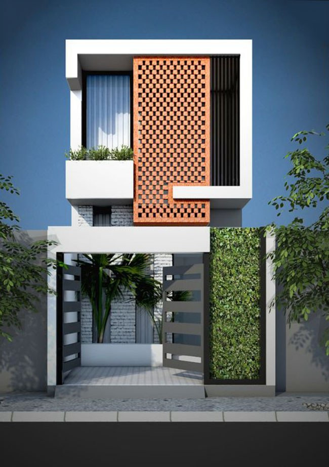 Mặt tiền nhà ống 2 tầng được được che chắn bằng cột bê tông hình trụ màu cam rỗng tạo kết cấu vững chắc. Ảnh: Wedo