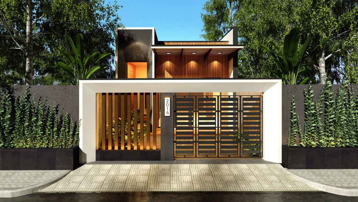 Điểm nhấn của căn nhà là mặt tiền thiết kế cách điệu với những mảng tường ốp gạch giả gỗ tạo cảm giác thân thuộc, gần gũi. Ảnh: Wedo