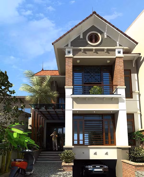 Ngôi nhà sử dụng những vật liệu cơ bản, gần gũi như sân vườn lát đá, mái thái ngói đỏ, kết hợp với cây xanh. Ảnh: Wedo.