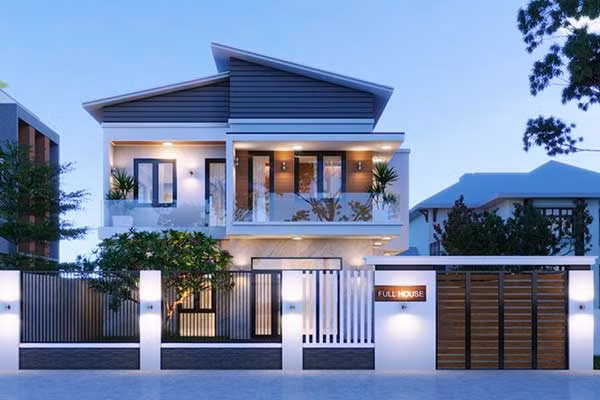 Ngôi nhà sử dụng gam màu trắng chủ đạo kết hợp nguyên vạt liệu như kính ở ban công, bê tông, gạch, gỗ ốp tường...tạo nên vẻ đẹp hiện đại. Ảnh: Xaydungso