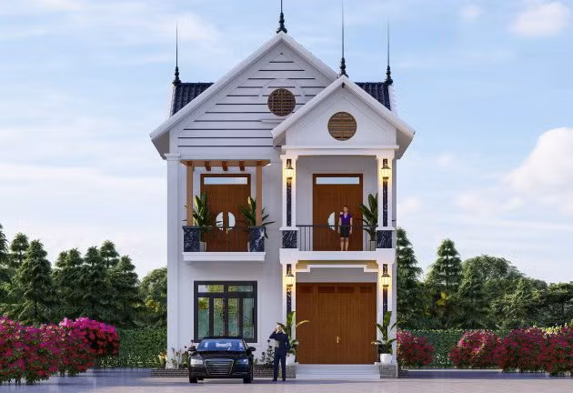  Nhà 2 tầng mái thái có tính năng tản nhiệt chống nóng tốt. Mặt tiền ngôi nhà được thiết bậc tam cấp dẫn vào cửa chính trang trọng. Ảnh: Wedo.