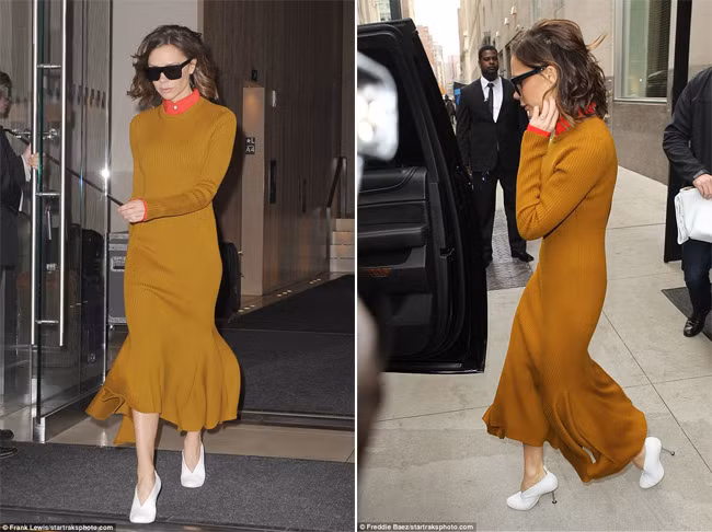 Nhà thiết kế 42 tuổi tỏa sáng trên đường phố New York với chiếc váy len dài màu vàng lạc đà. Chiếc váy len dài cổ tròn yểu điệu hơn nhờ phần chân váy xòe và bớt nhàm với điểm nhấn là chút màu cam ở cổ và tay áo sơ mi bên trong. (Ảnh: Frank Lewis)