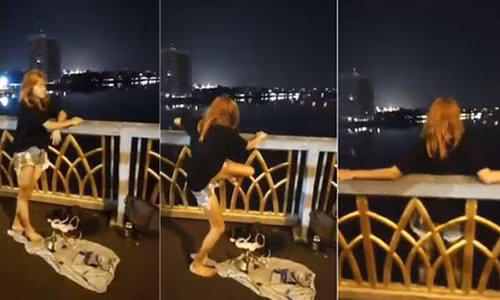 Cảnh cô gái nhảy xuống sông để tự tử vì tình khiến nhiều người sốc. Ảnh: Asiaone.