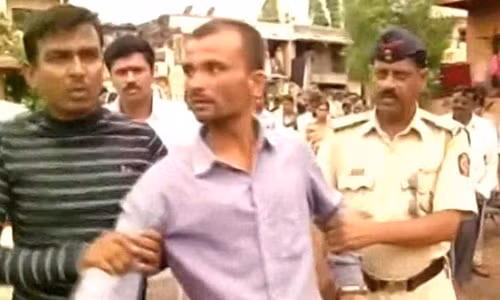 Người cha tàn nhẫn khi bị bắt giữ.