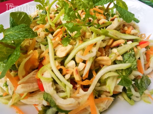 Bước 8: Trộn 1/2 số rau mùi + rau húng còn lại vào tô. Bày ra đĩa rắc lạc rang lên trên rồi thưởng thức.