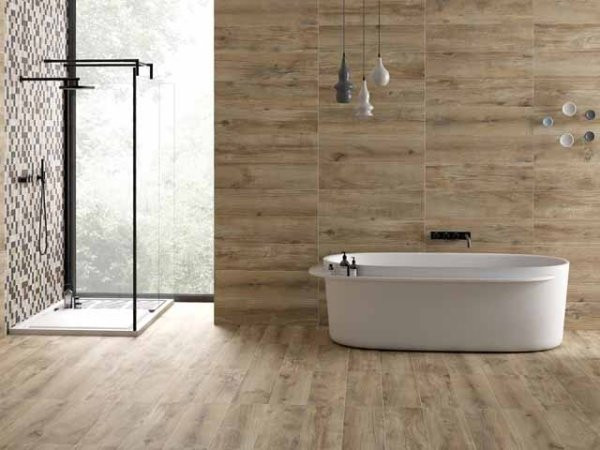 Không gian thư giãn được ưu tiên sử dụng chất liệu gỗ cho toàn bộ tường và sàn. Căn phòng trở nên ấn tượng hơn khi được chia hai khu vực bồn tắm và khu vực tắm đứng với điểm nhấn từ ánh sáng và vách ngăn kính hiện đại.