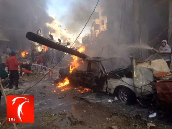 Hiện trường vụ đánh bom ở trung tâm Homs ngày 12/12.