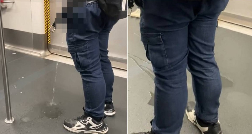 Nguoi dan ong di tieu ngay tren tau dien ngam gay choang