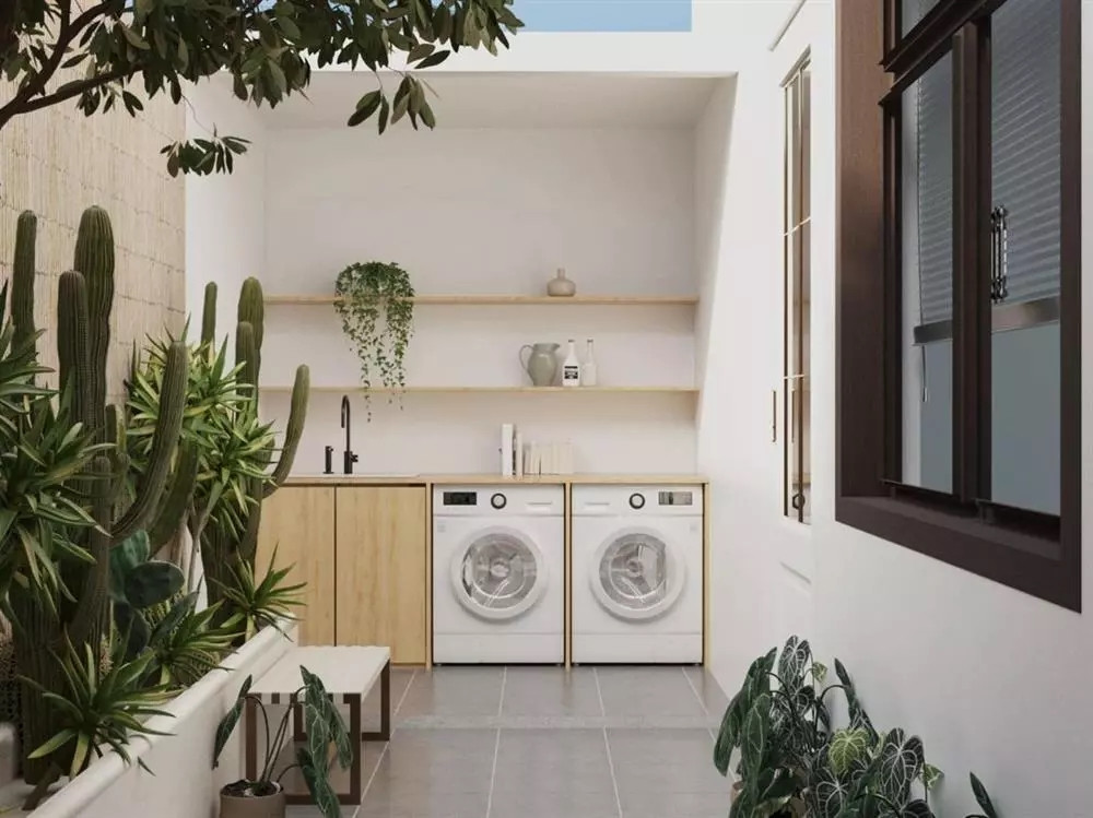 Khu vực giặt đồ thoáng đãng, ngập tràn ánh sáng. Ảnh: House n Home