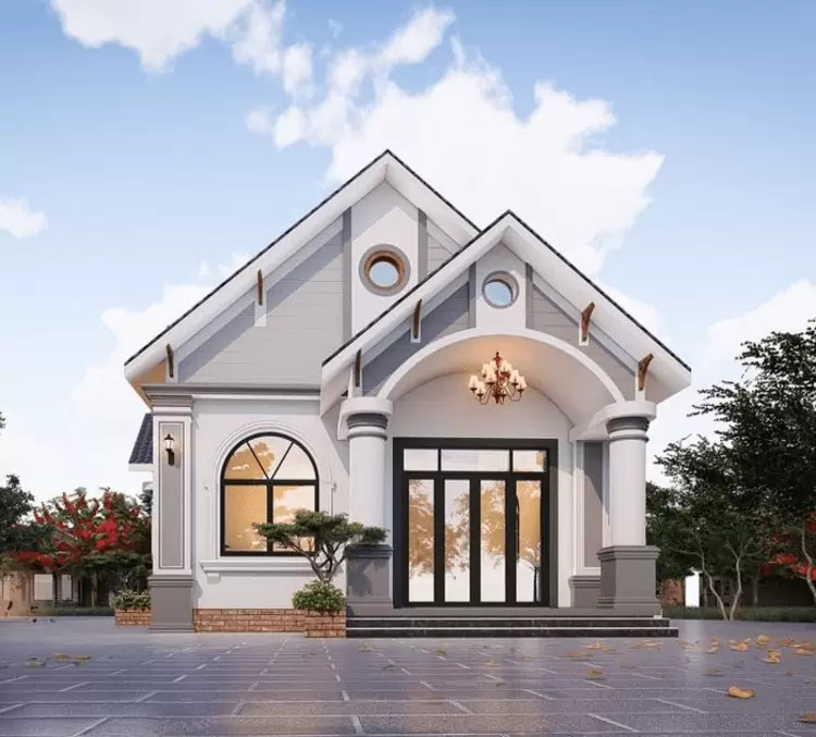 Nhà mái thái cấp 4 thiết kế đơn giản, cửa sổ vòm kết hợp đèn chùm trước hiên tạo điểm nhấn cho toàn bộ kiến trúc ngoại thất. Ảnh: Internet