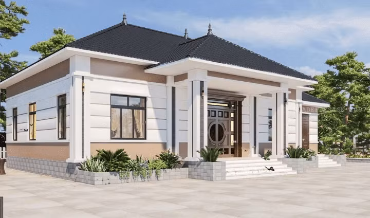 Nhà cấp 4 mái Nhật mang phong cách hiện đại nổi bật với khoảng sân rộng rãi và hệ thống bồn hoa trước nhà. Ảnh: Internet