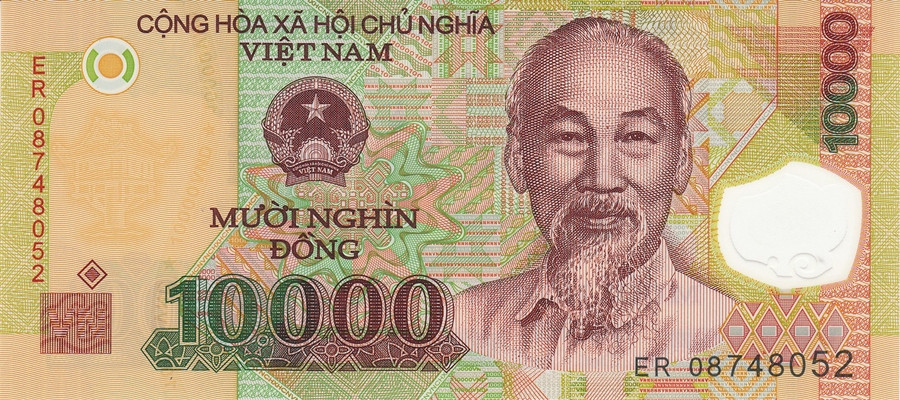 Tờ 10.000 đồng phát hành ngày 30/8/2006 có màu nâu đậm trên nền màu vàng xanh. Trên tờ tiền có in cảnh khai thác dầu khí. Ảnh: RDSiC