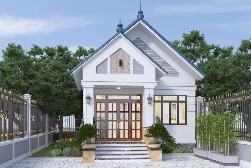 Ngôi nhà sở hữu ngoại thất khá đơn giản với gam màu trắng nhẹ nhàng và sân trước ốp gạch. Ảnh: Wedo